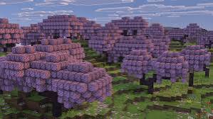 Rows of pink and purple blossom tree canopies across a Minecraft hillside