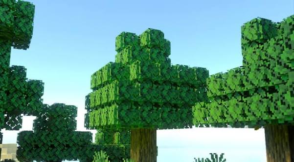 Close view of broad green Minecraft tree canopies against a blue sky
